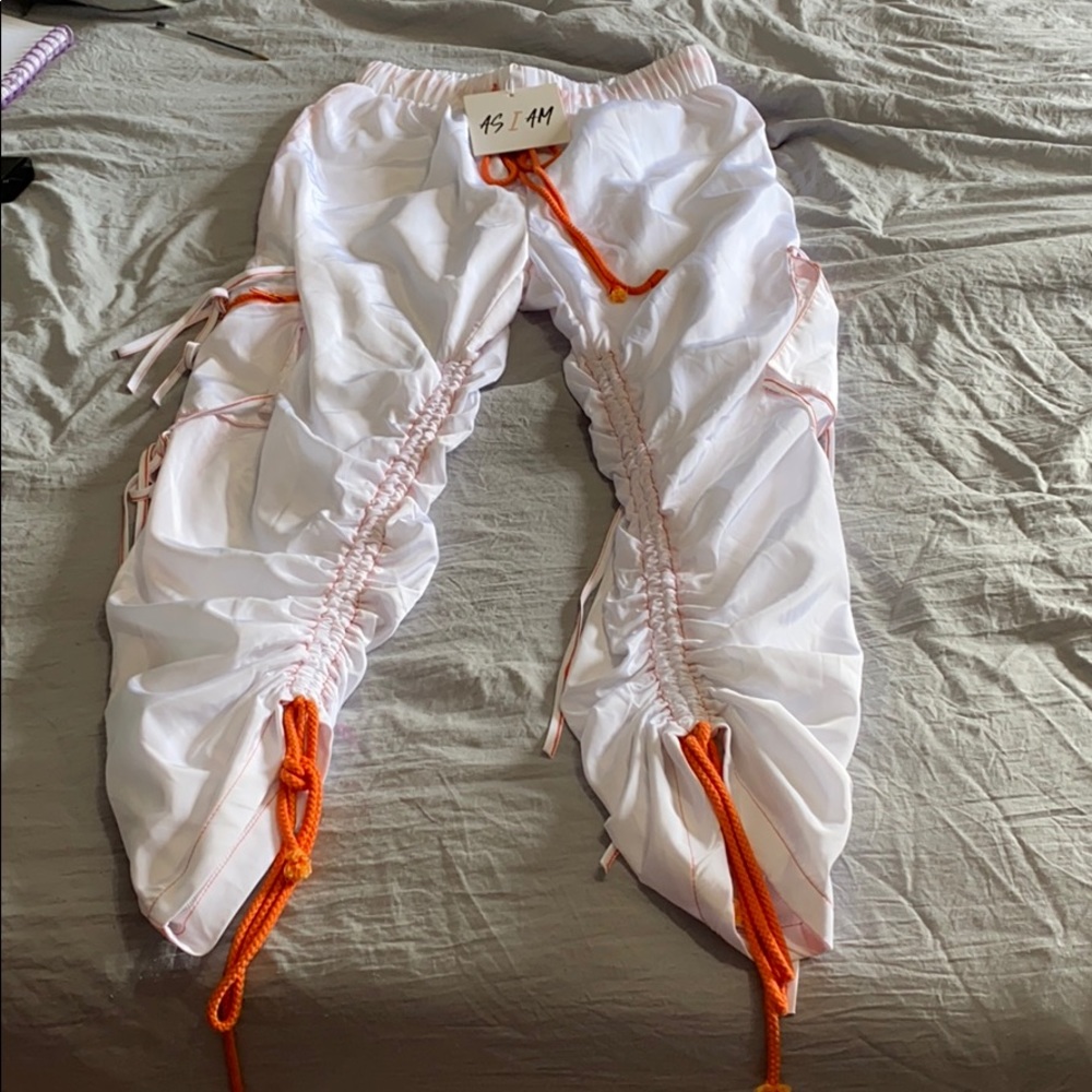 DOLLS KILL WHITE AND ORANGE TRACKPANTS!